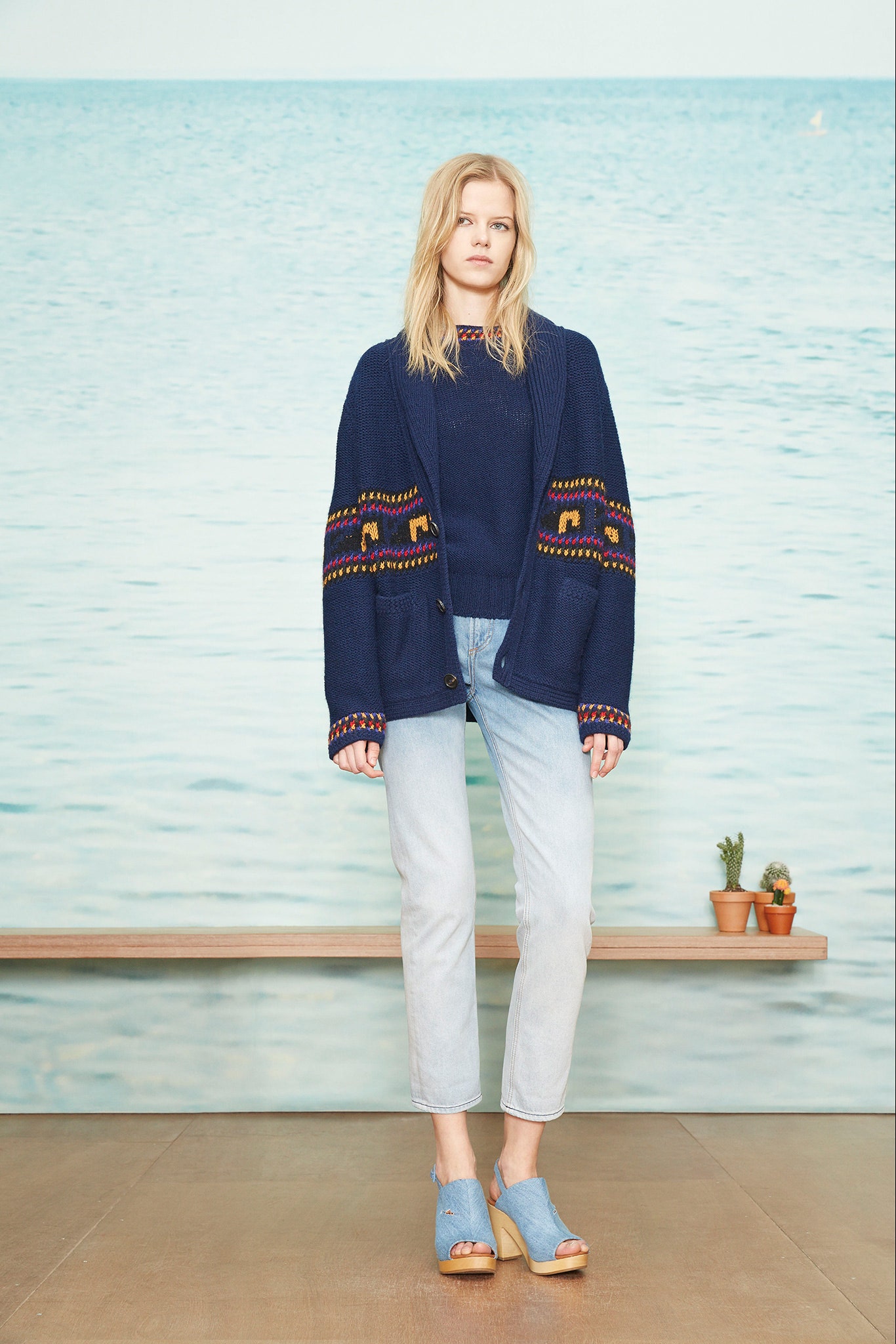 blue relaxed sweater with denim pants