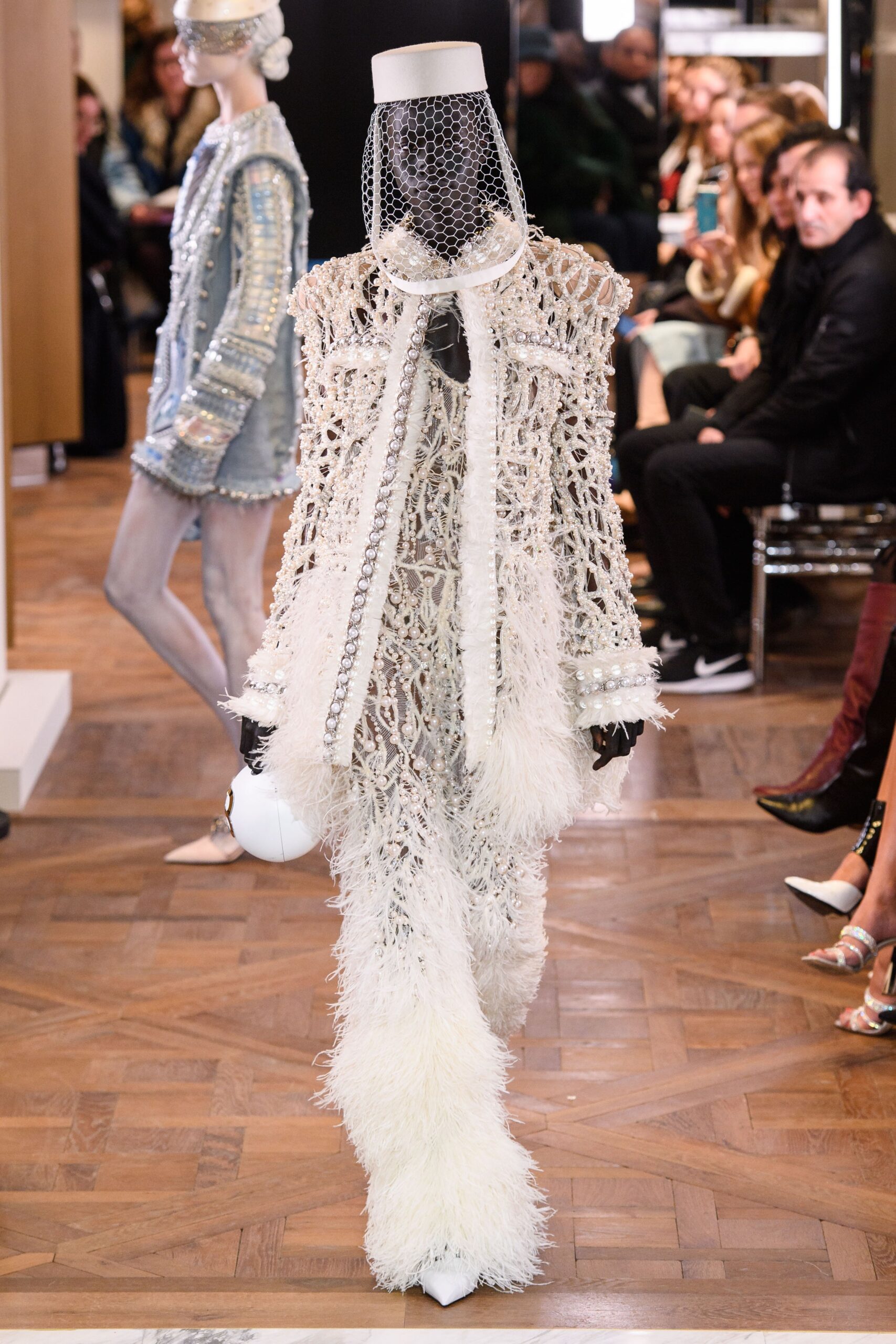 white fitted jumpsuit with fringes