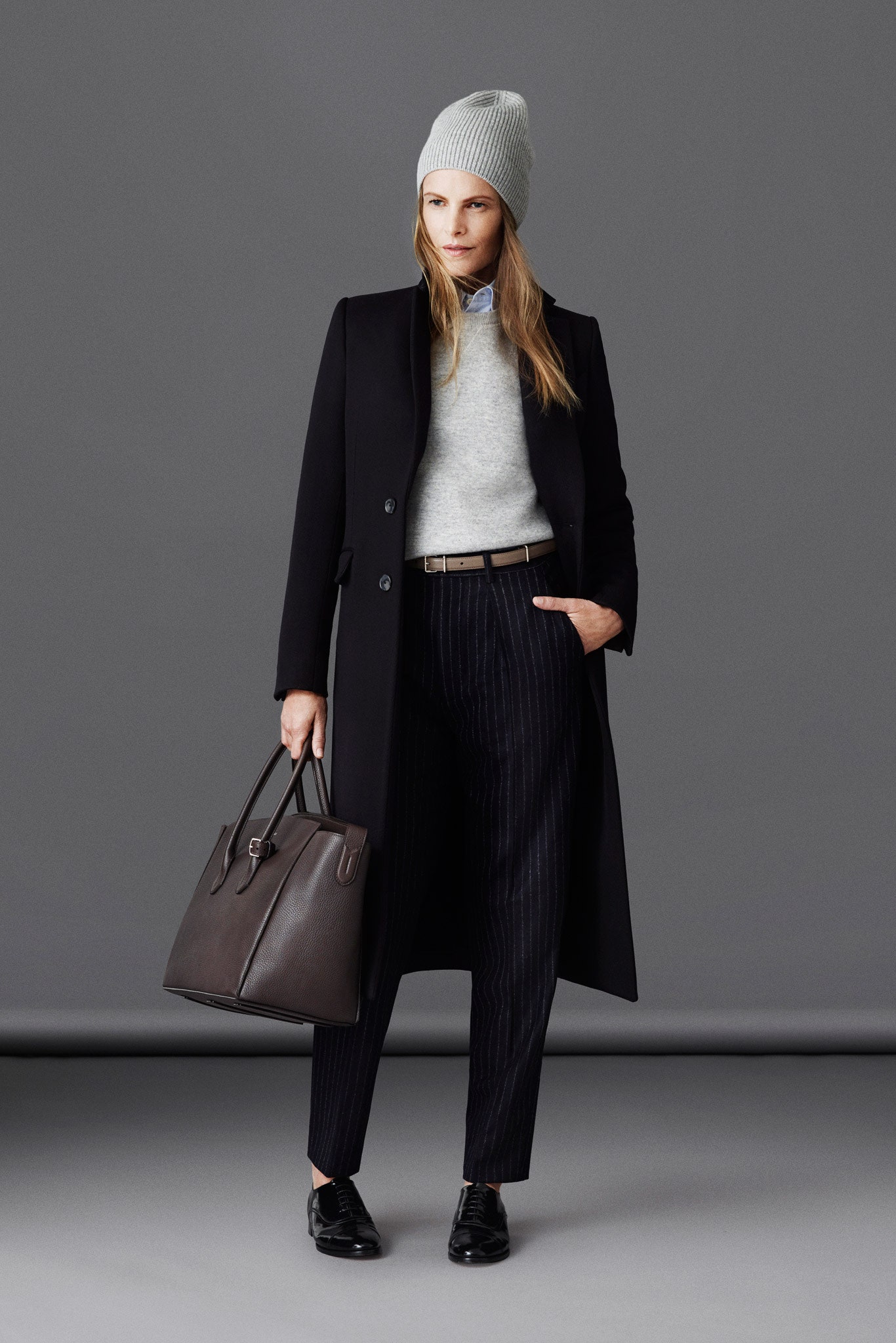 black wool coat with gray sweater