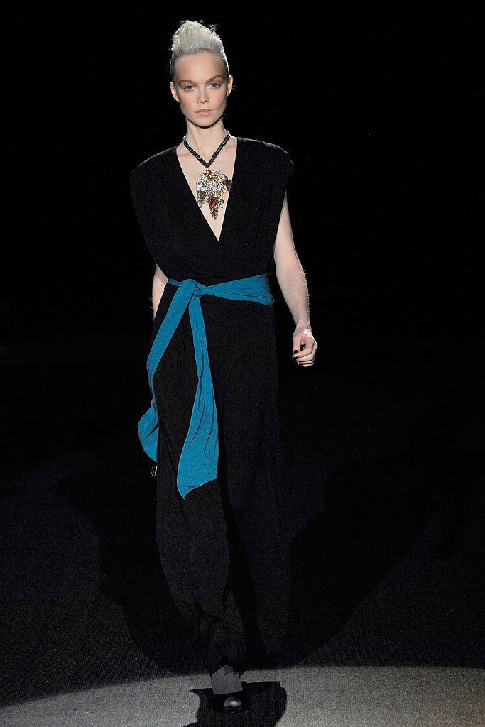 black fitted jumpsuit with blue belt
