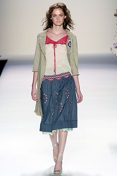 beige top with blue skirt