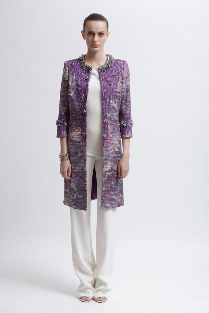purple embroidered coat with white top and pants