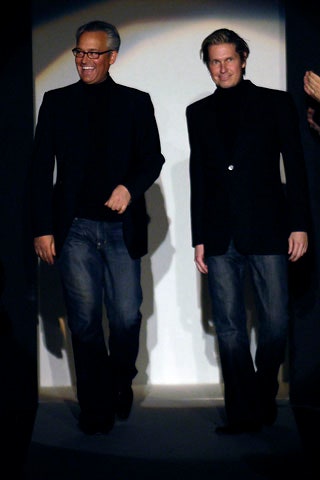 black tailored blazer and blue jeans