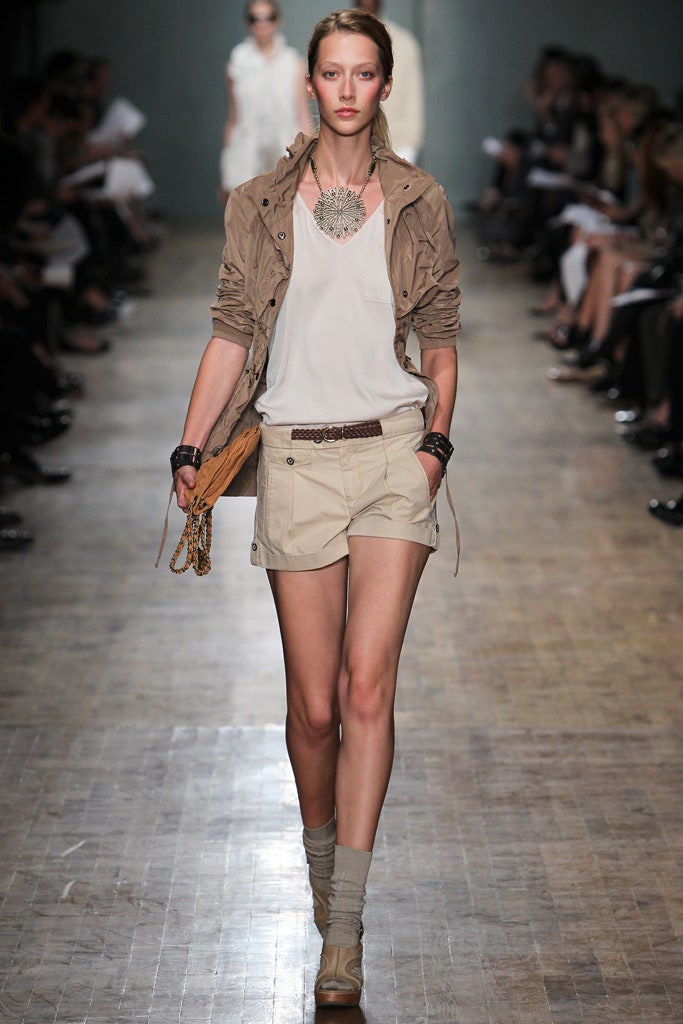 beige jacket white top beige shorts