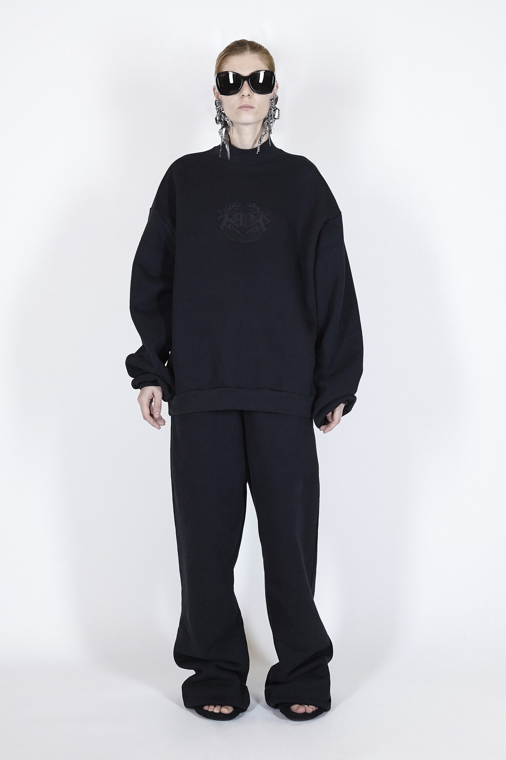 black oversized sweater and relaxed pants