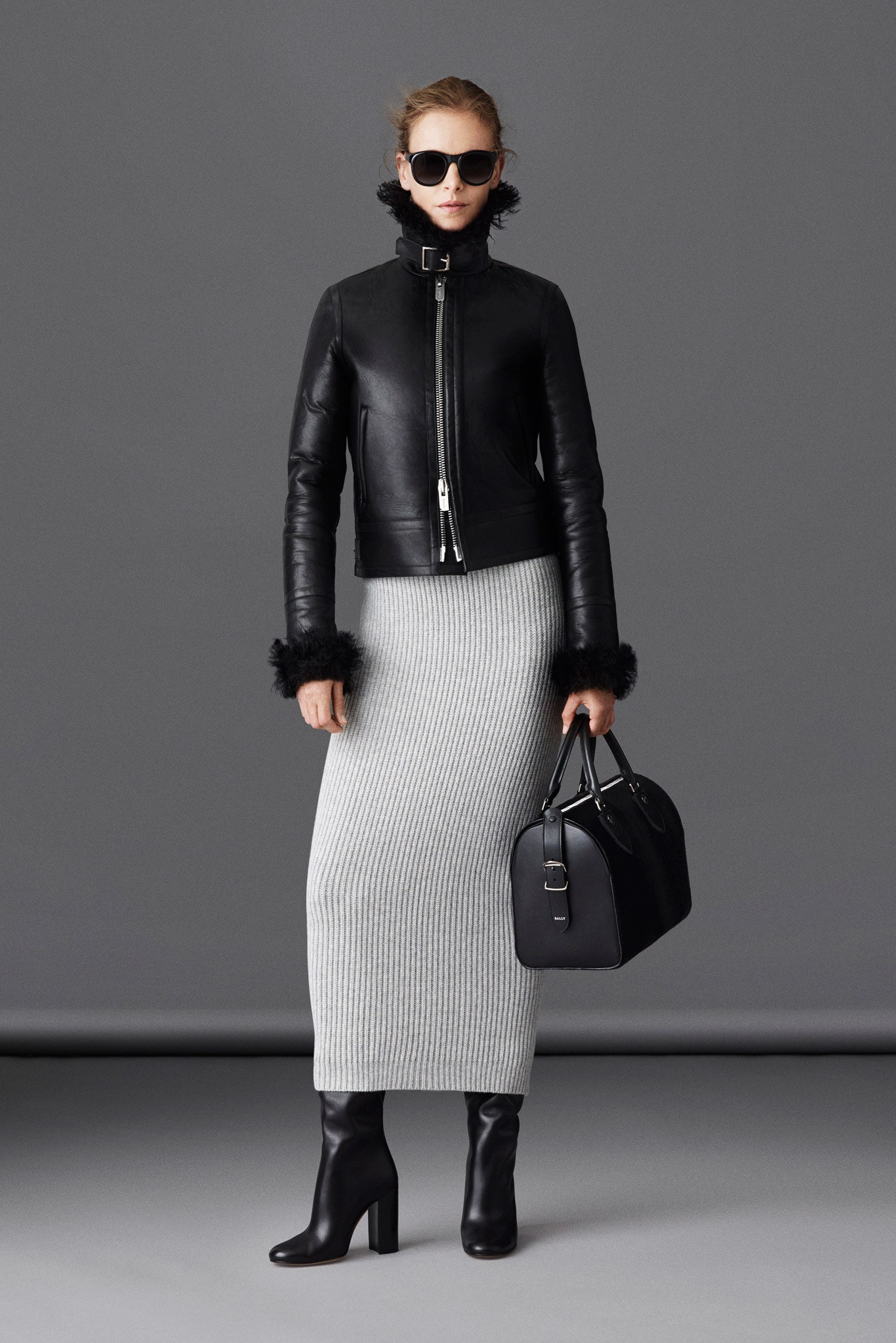 black leather fitted jacket with gray knit skirt