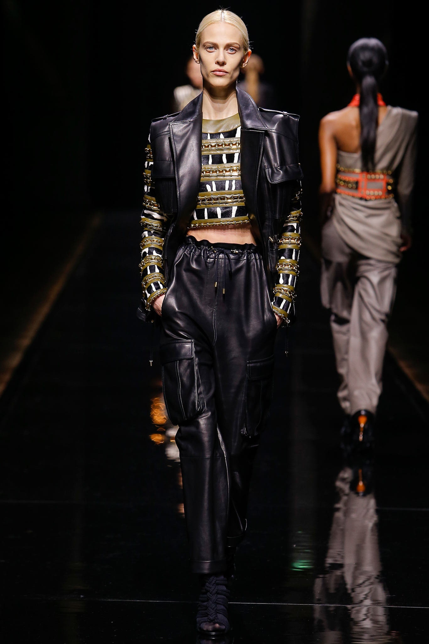 black leather fitted top and relaxed pants