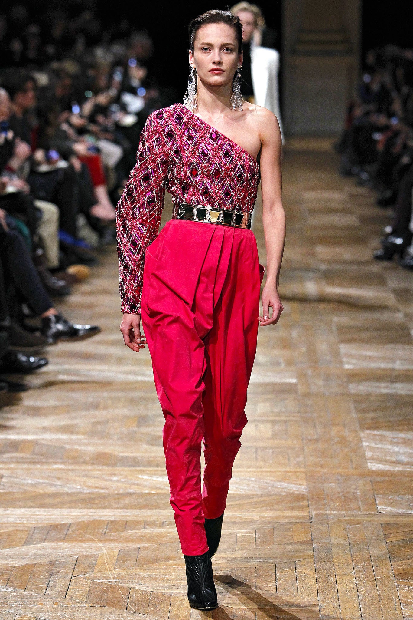 pink embroidered asymmetric top with red pants