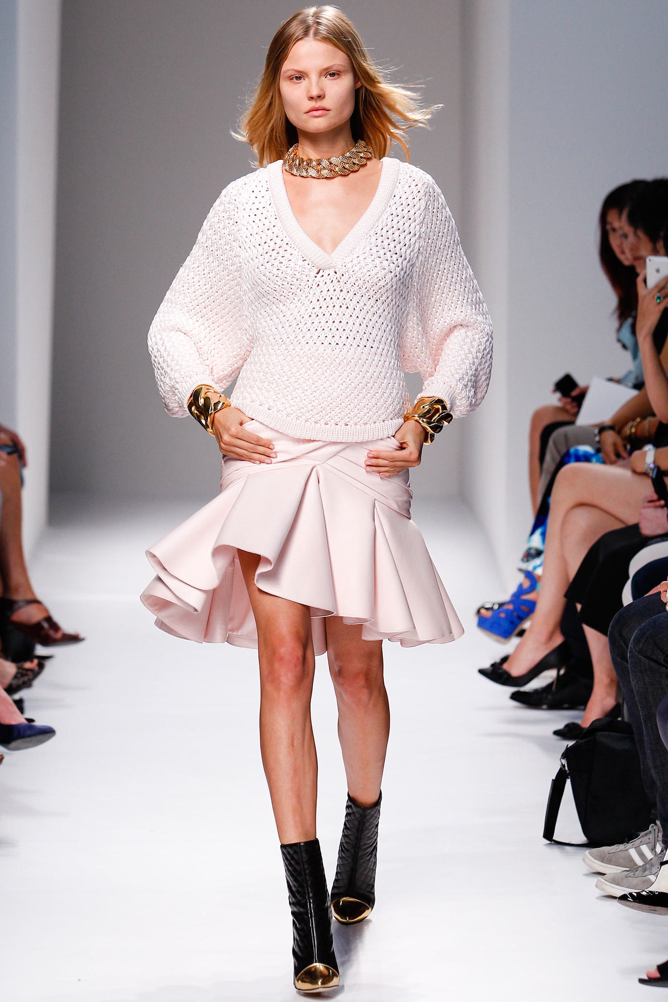 white knit relaxed top with pink flared skirt