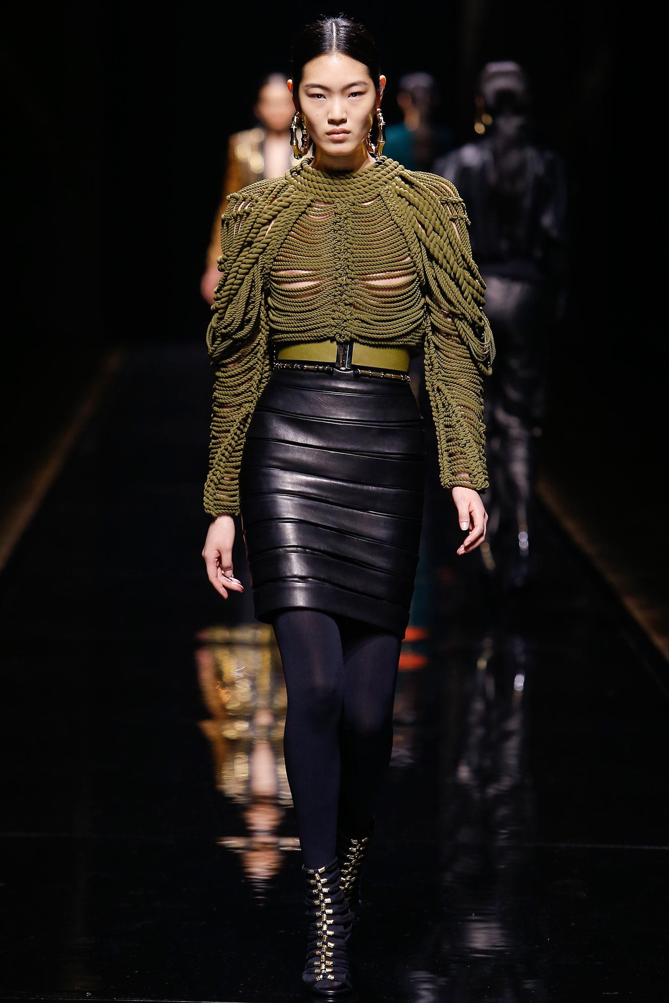 fitted green knit top and black leather skirt