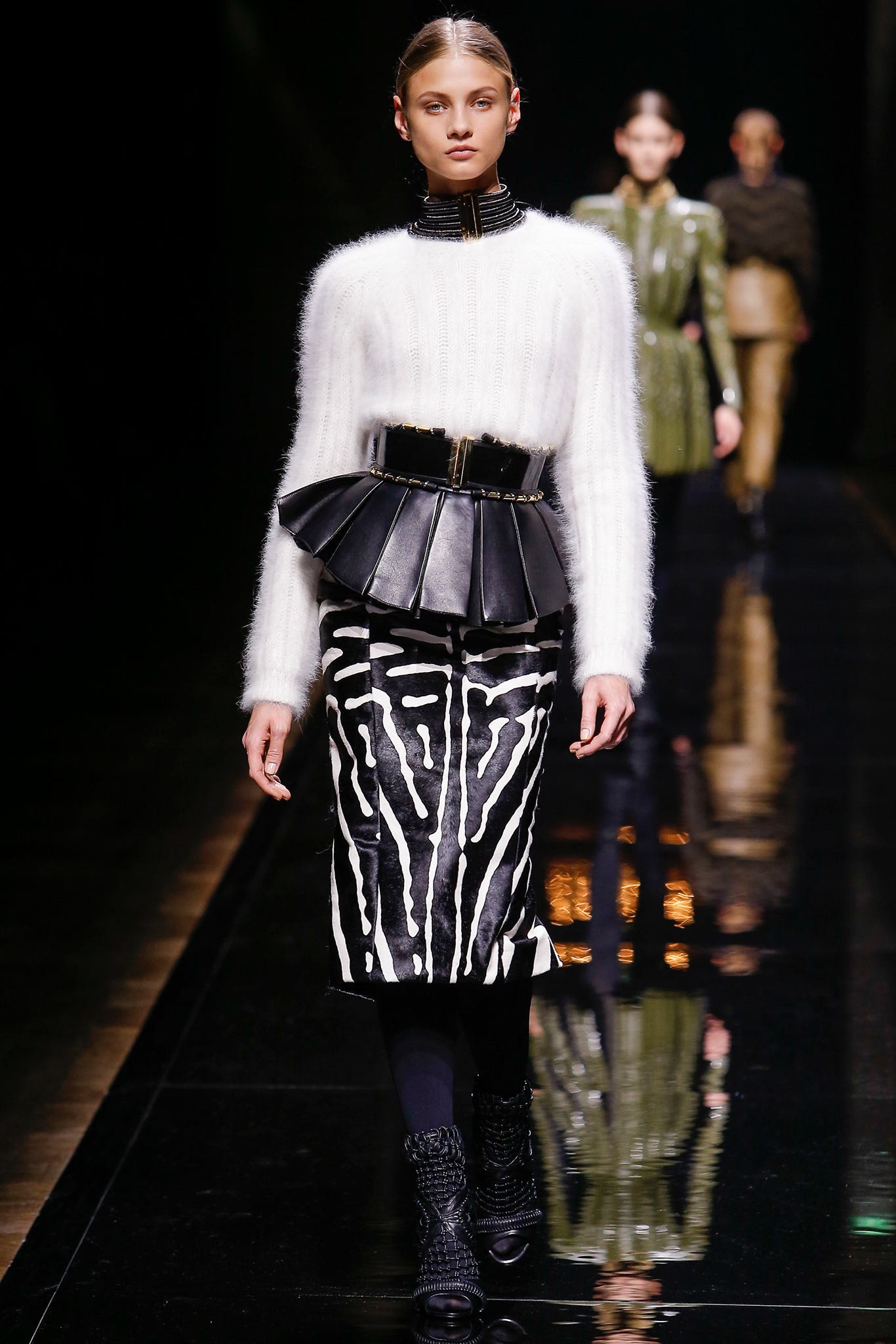 fitted white wool top and black leather skirt