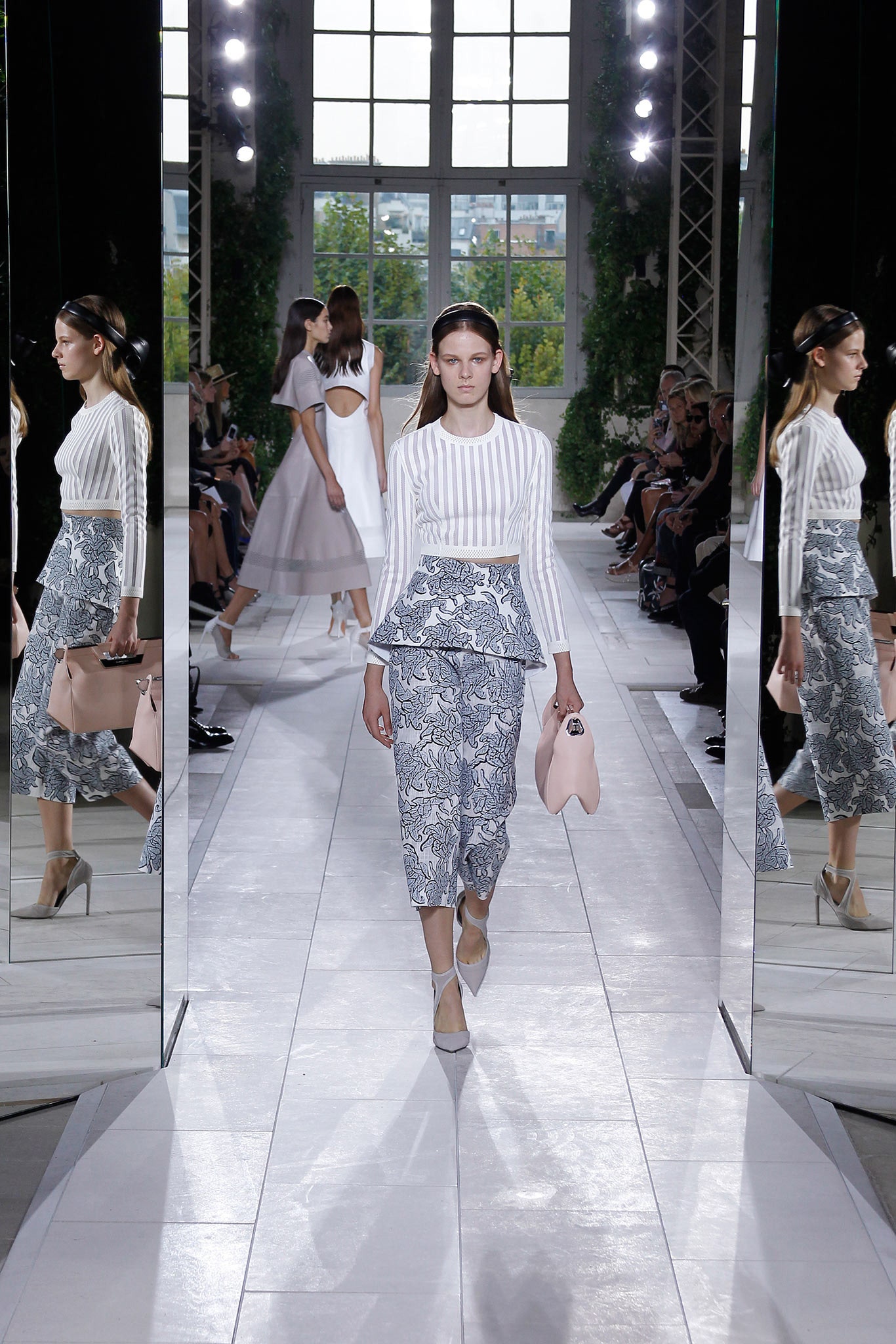 white fitted top with blue pencil skirt