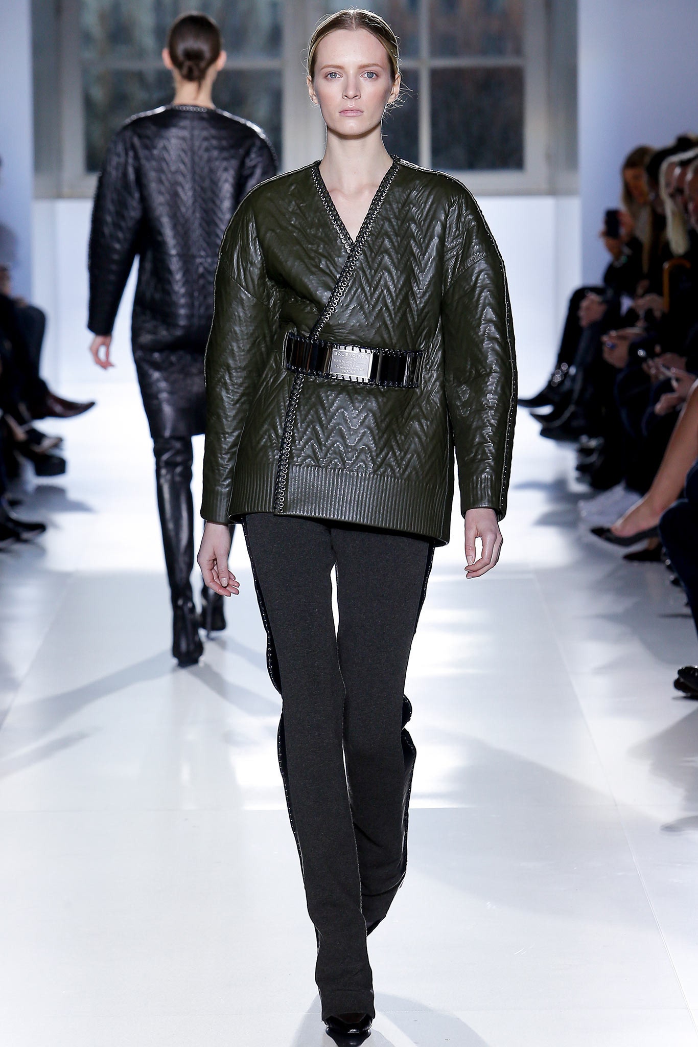green leather relaxed jacket and black slim pants