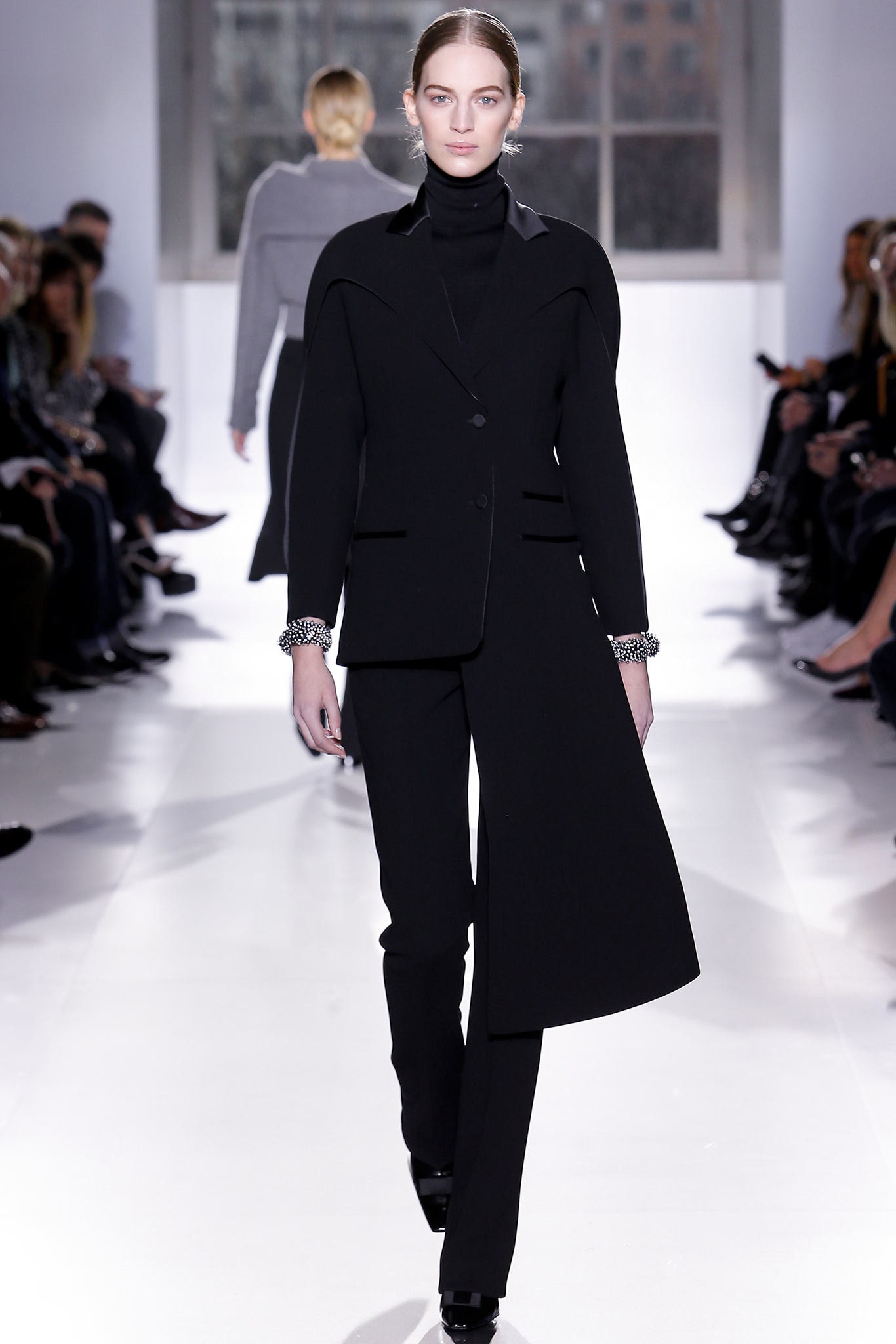 black tailored suit with asymmetric design