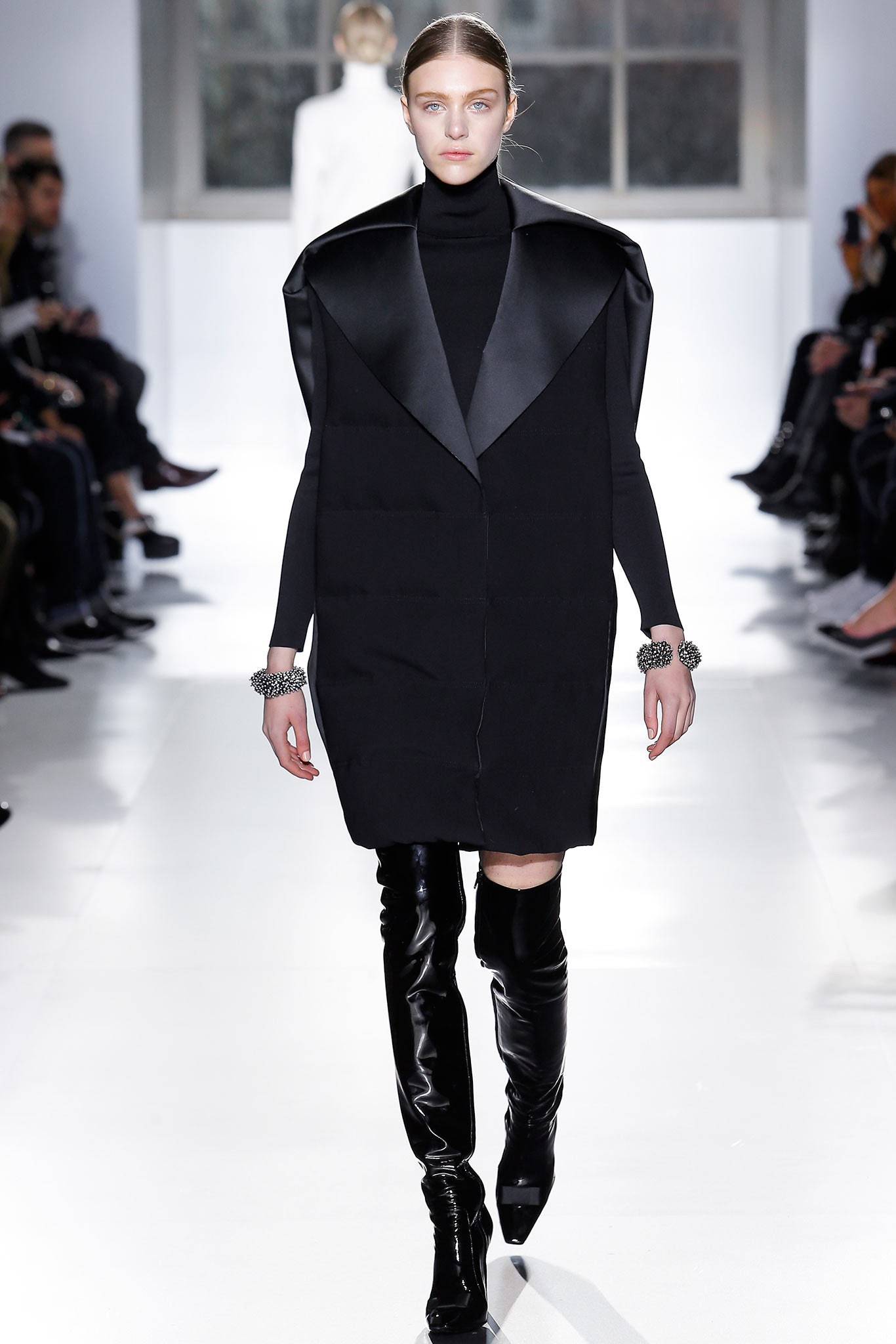 black fitted coat with high boots