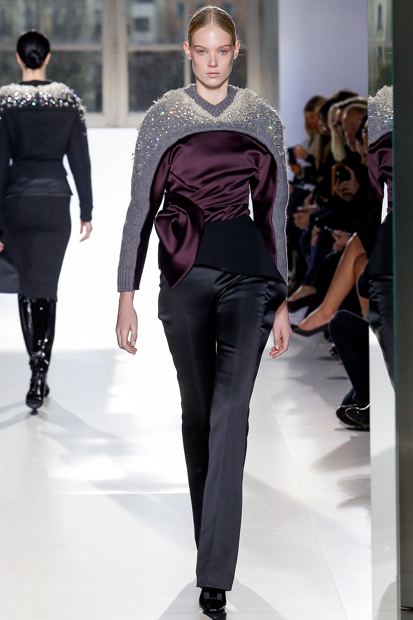 gray embellished top with black pants