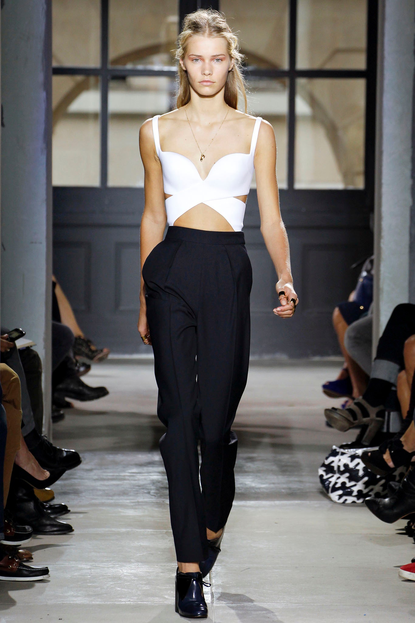fitted white cutout top with tailored black pants