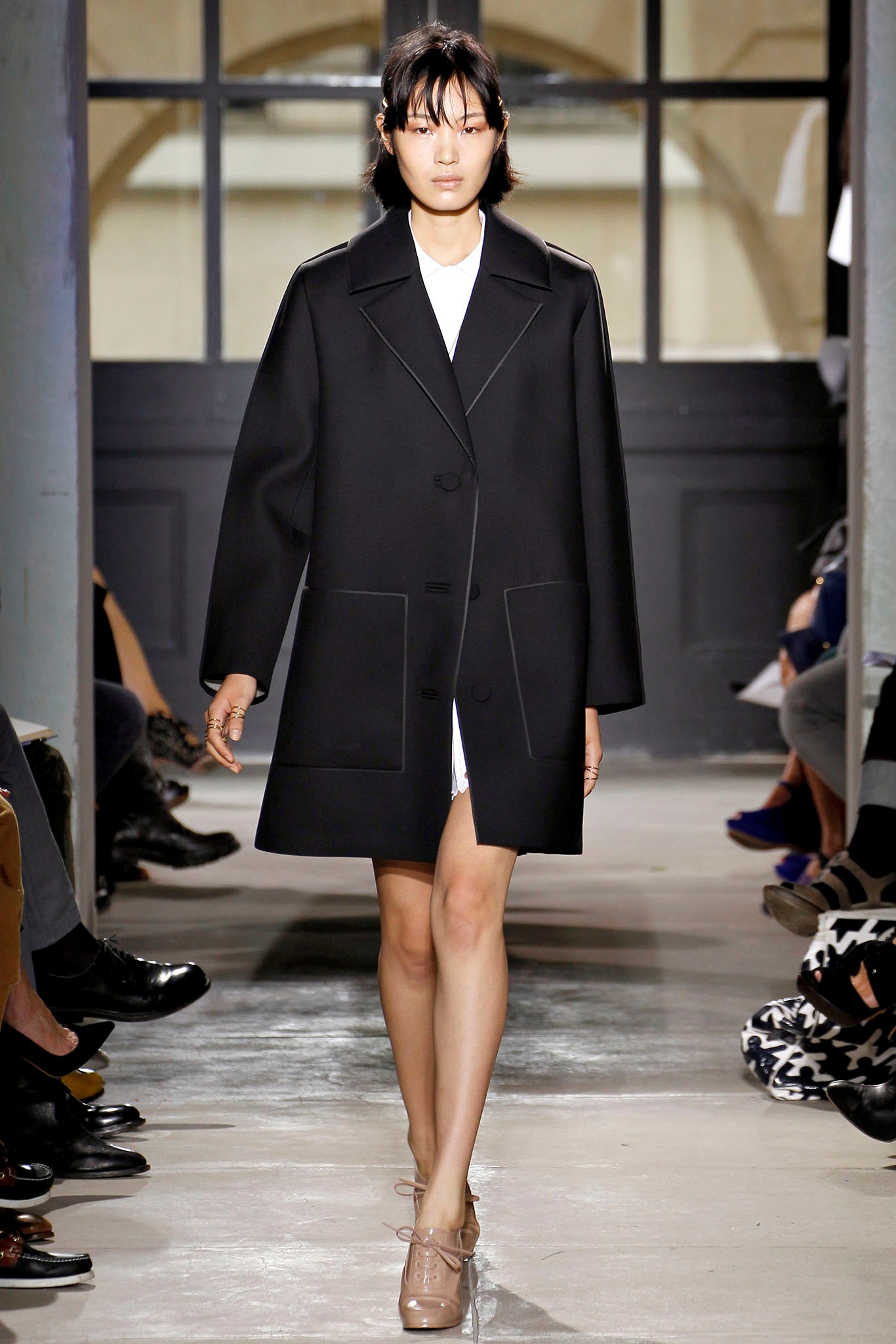 black coat over white dress