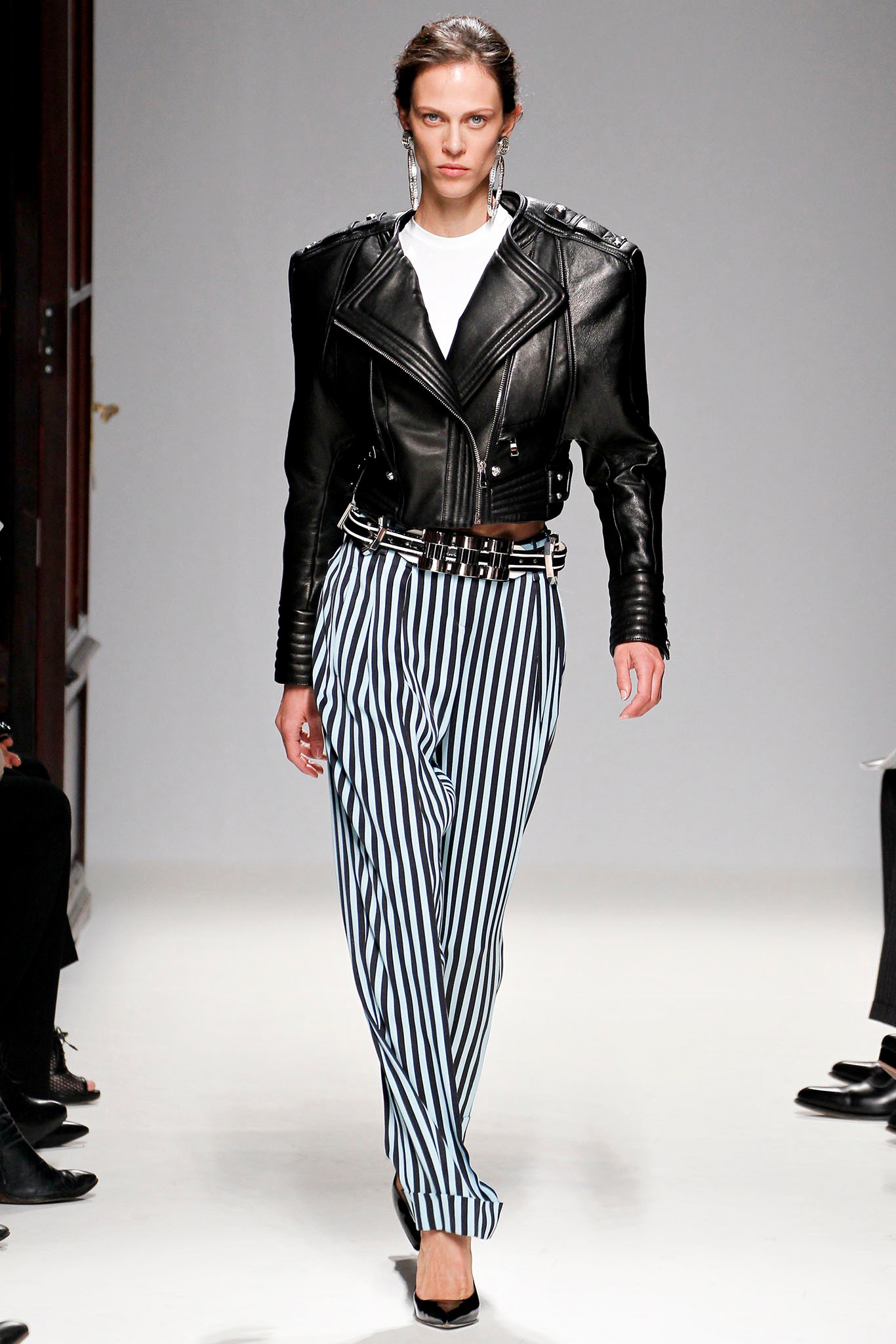 black leather fitted jacket with striped pants