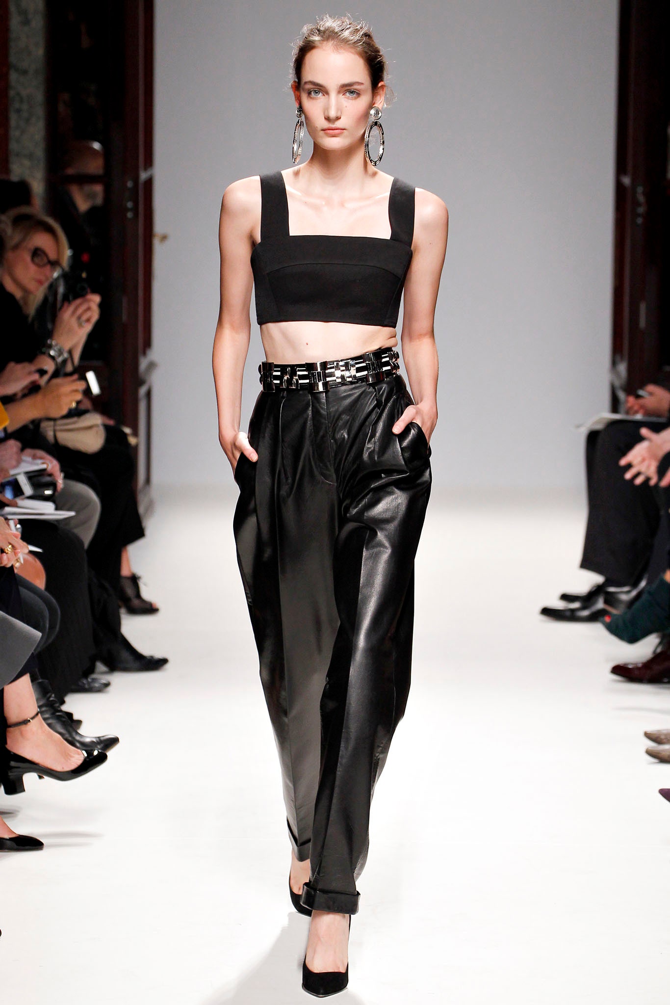 black fitted top and relaxed leather pants