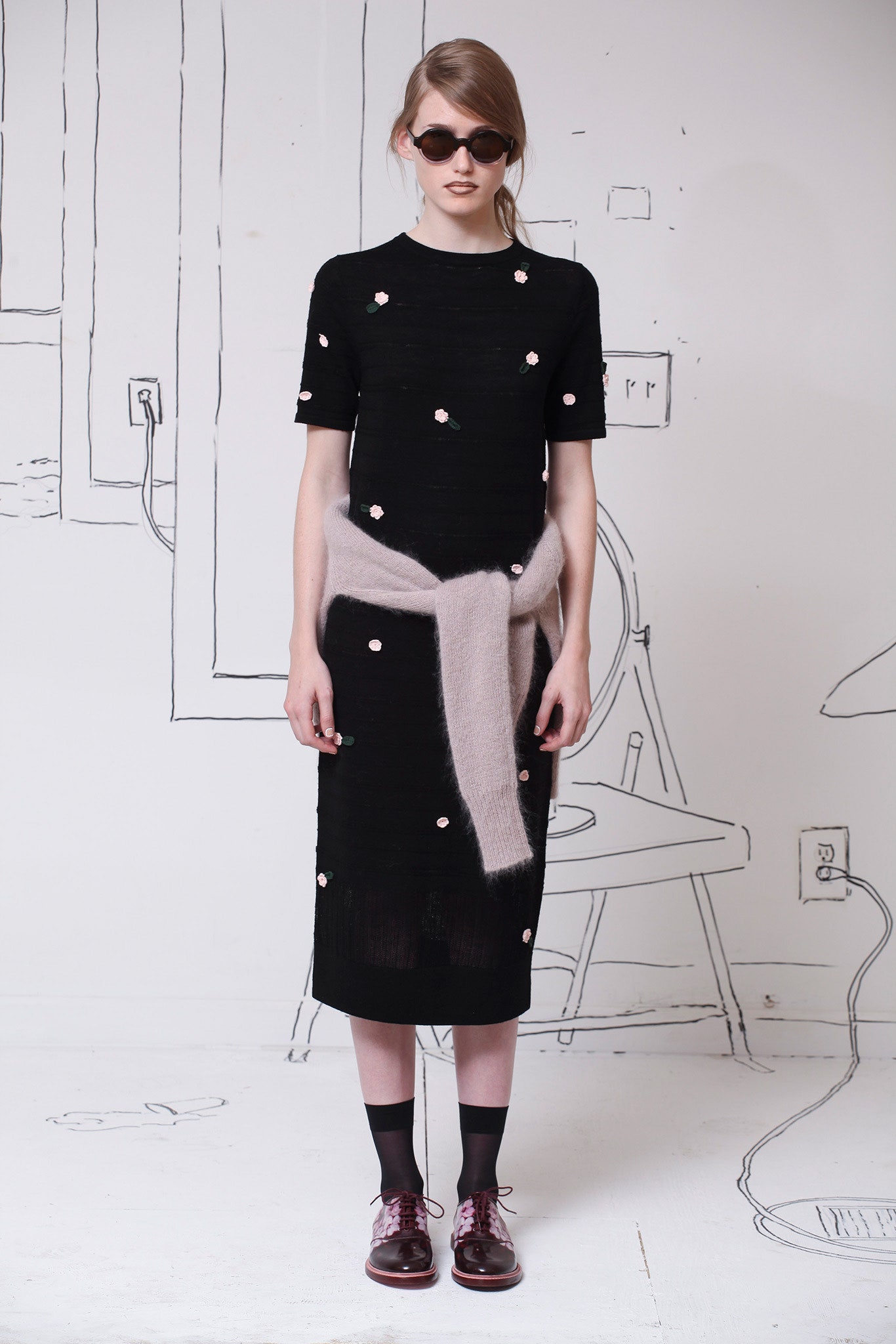 black fitted midi dress with beige sweater