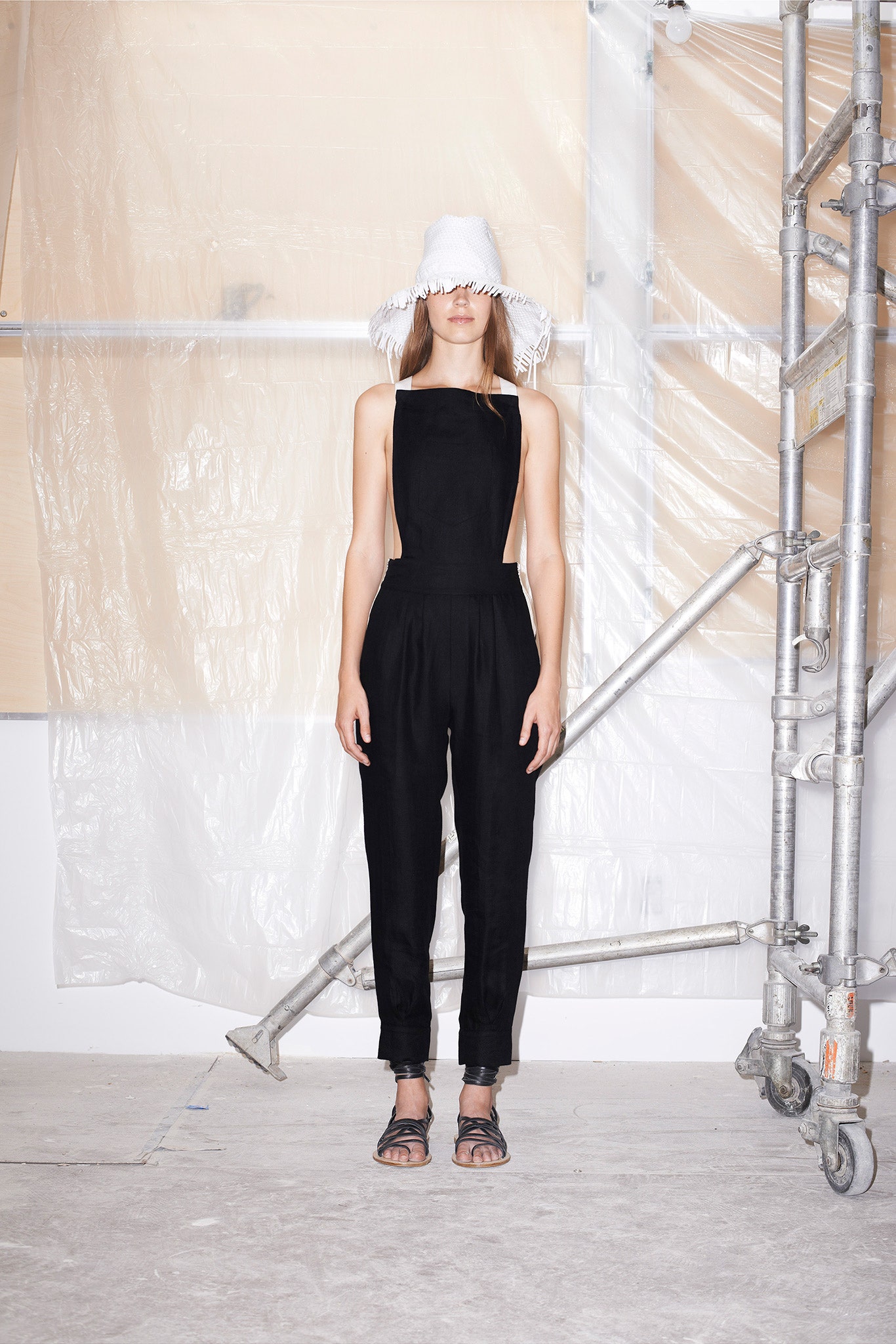 black fitted jumpsuit with cutouts