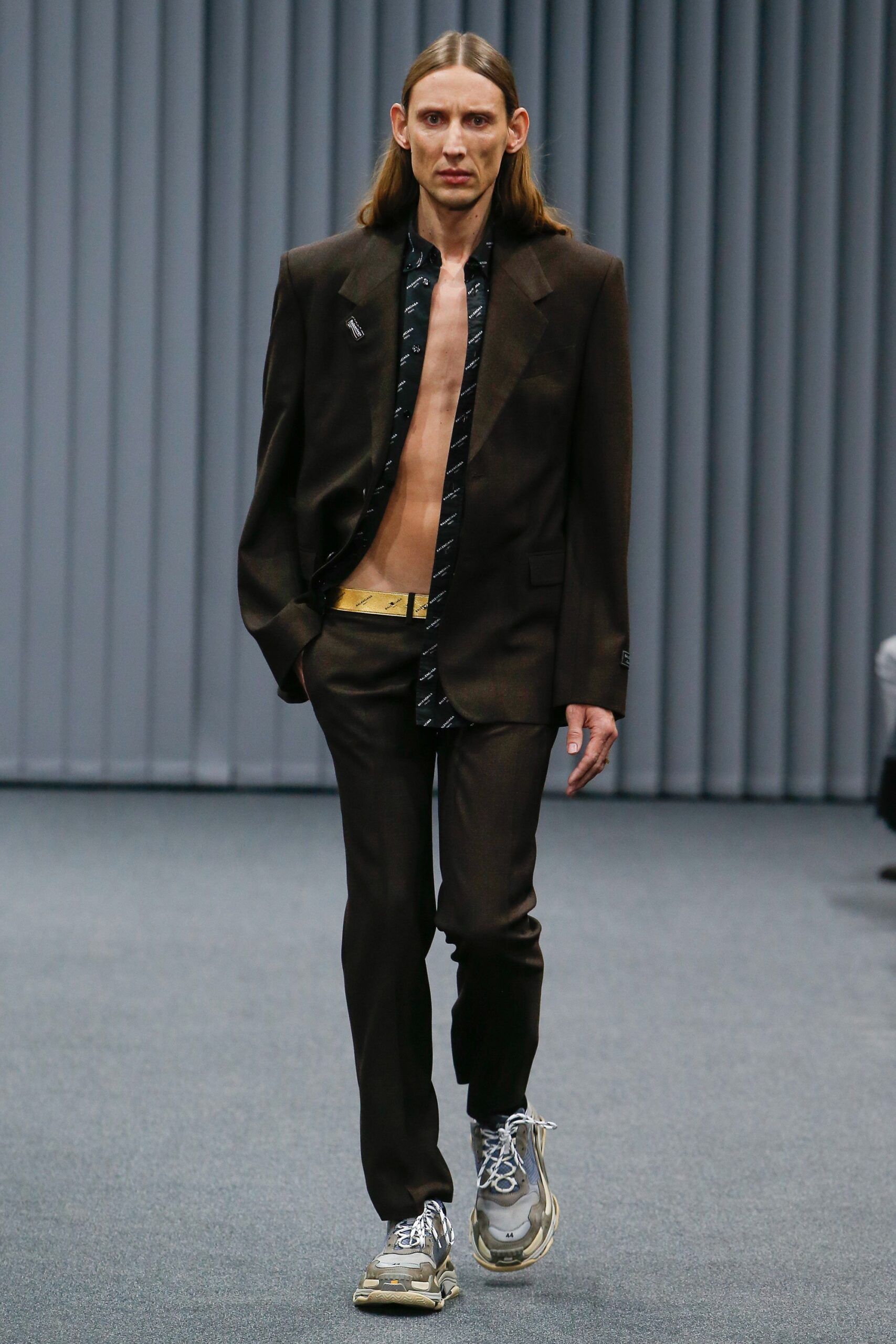 brown tailored suit with printed shirt