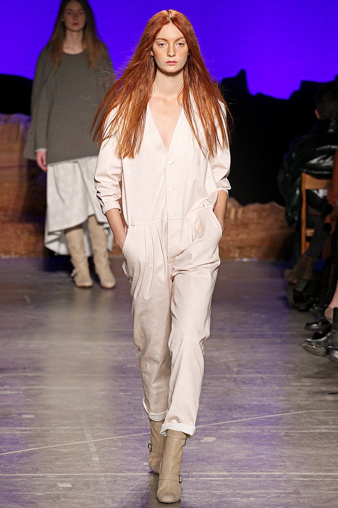 white relaxed jumpsuit with beige boots