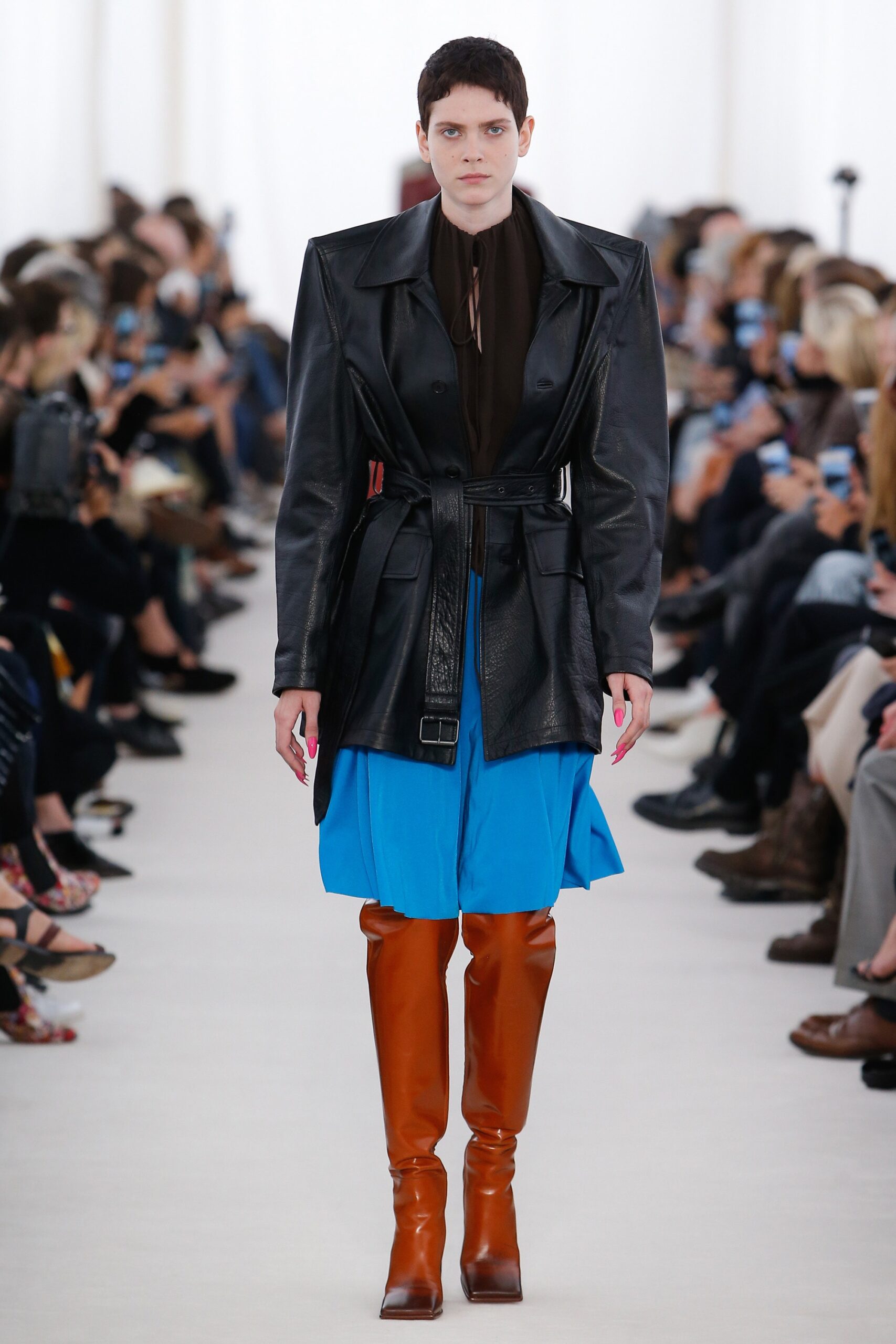black leather coat with blue skirt