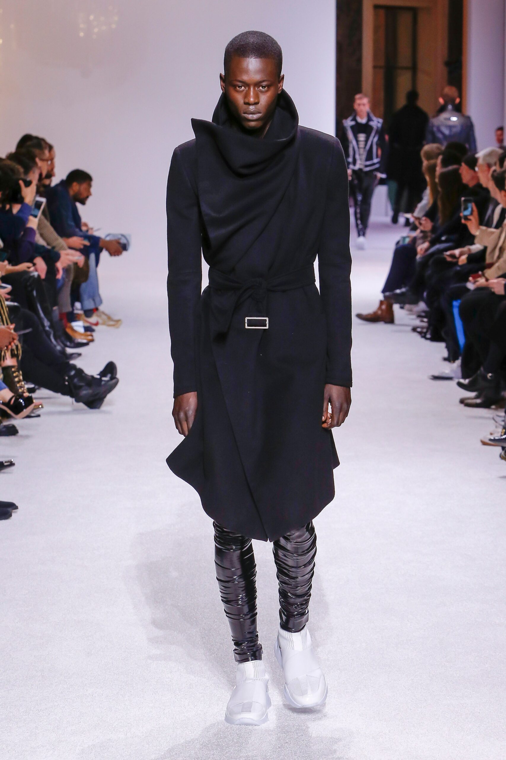 black wool coat with vinyl pants