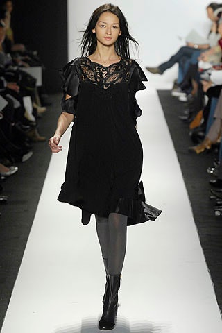 black relaxed mini dress with ruffles