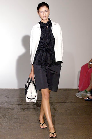 black ruffled high-neck blouse