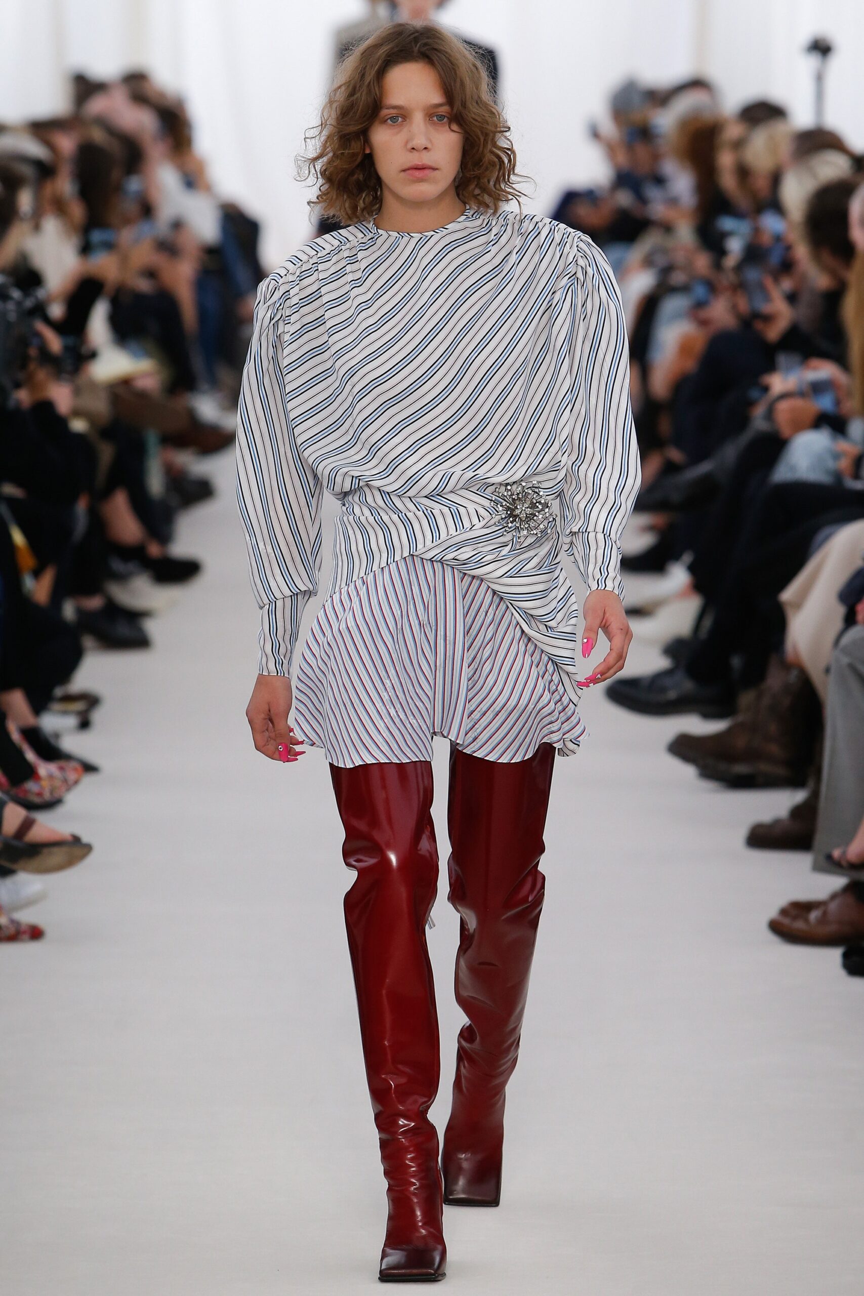 white and blue ruched mini dress with red boots