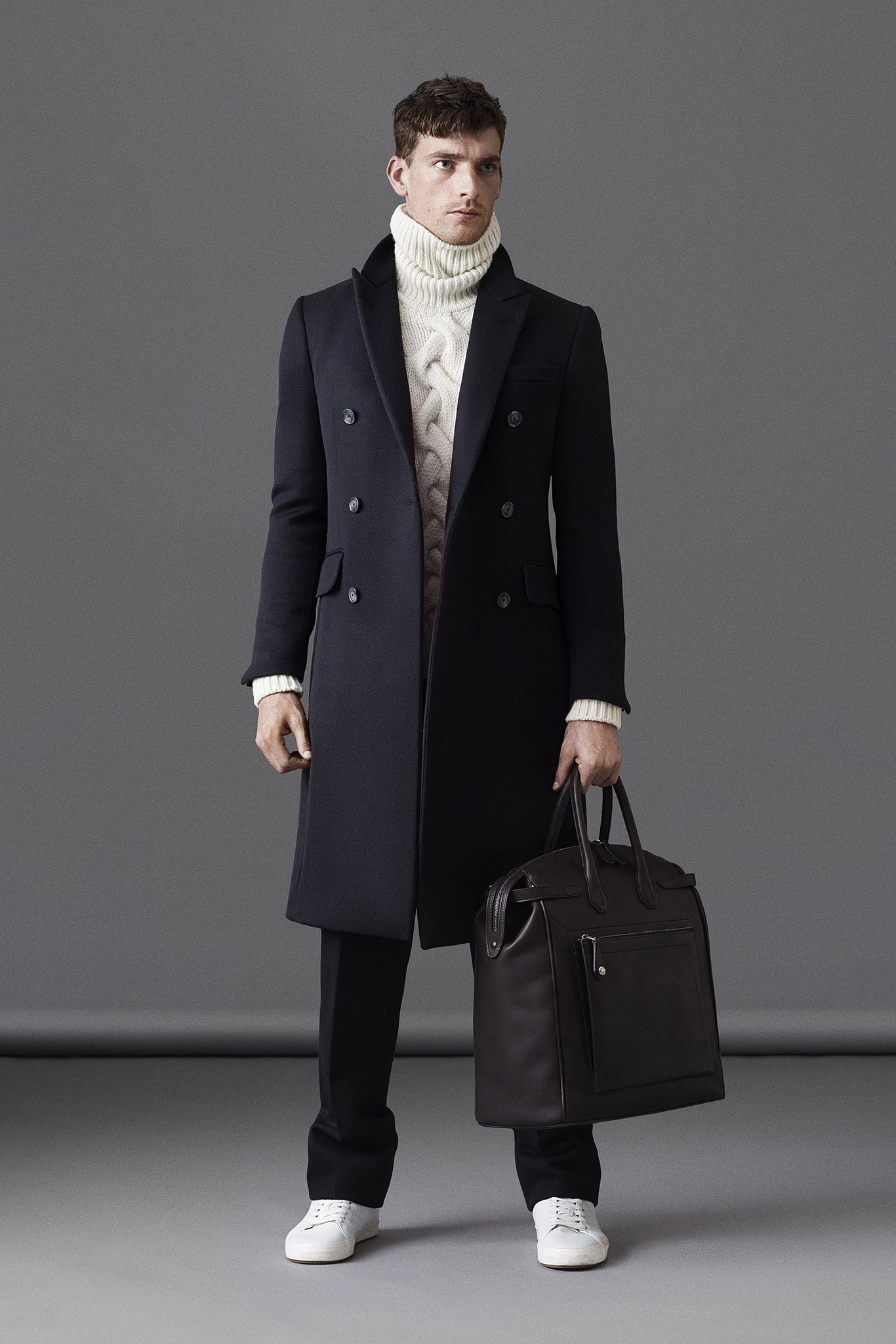 black tailored coat with white sweater