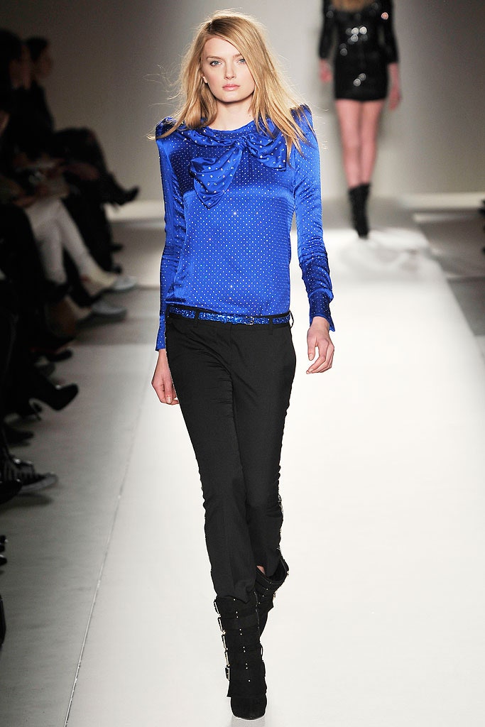 blue silk ruffled top and black slim pants