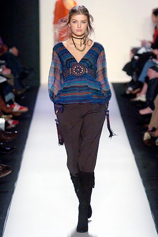 blue silk relaxed top with black pants