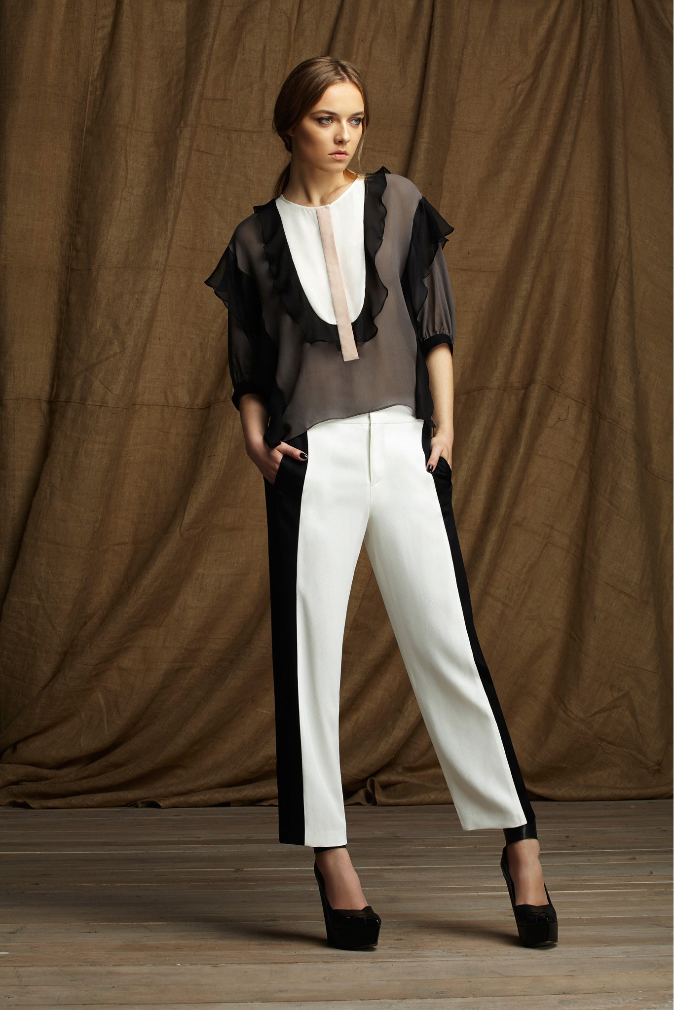 black and white ruffled blouse with tailored pants