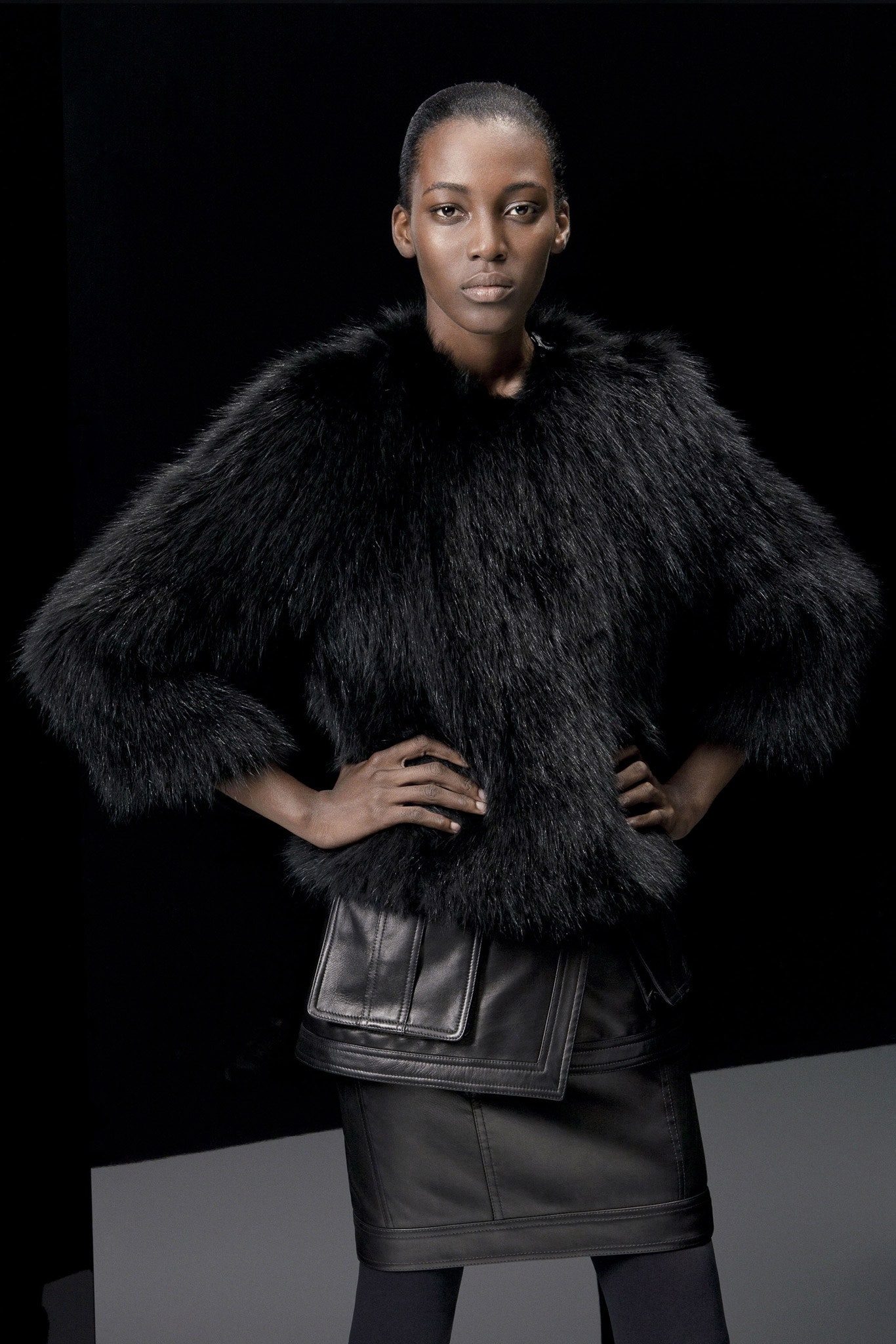 black faux-fur top and leather skirt