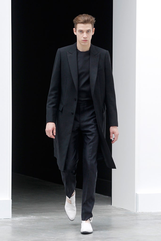 black tailored coat with slim pants