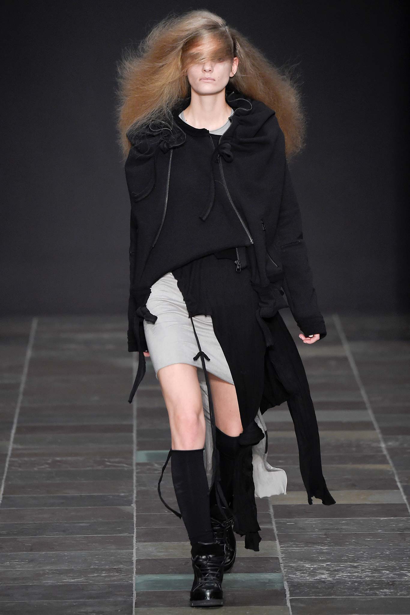 black jacket gray top asymmetric skirt