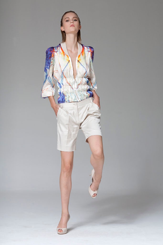 multi-colored silk jacket and beige shorts