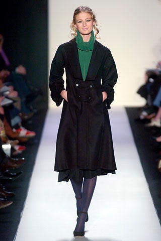 black wool coat with green sweater