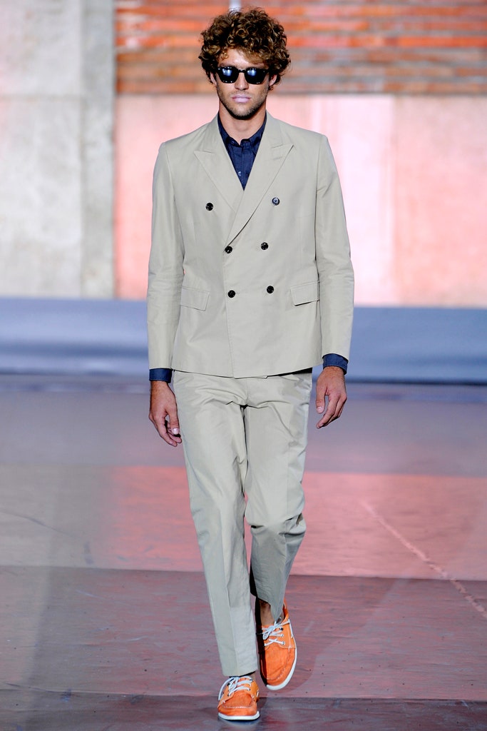 beige tailored suit with orange shoes