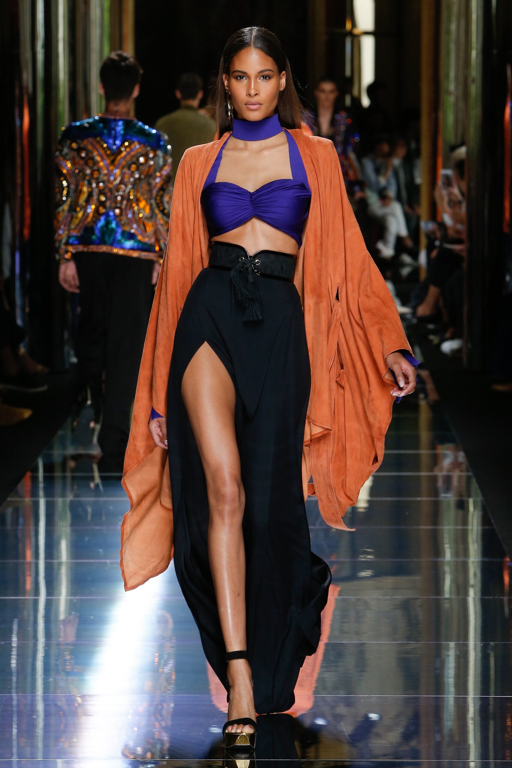 purple halter top black skirt orange coat