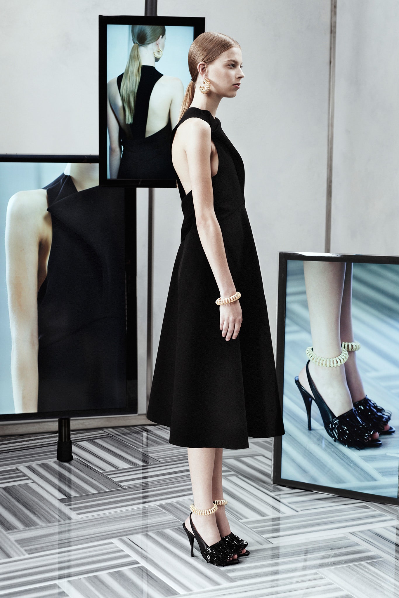 black silk midi dress and embellished shoes