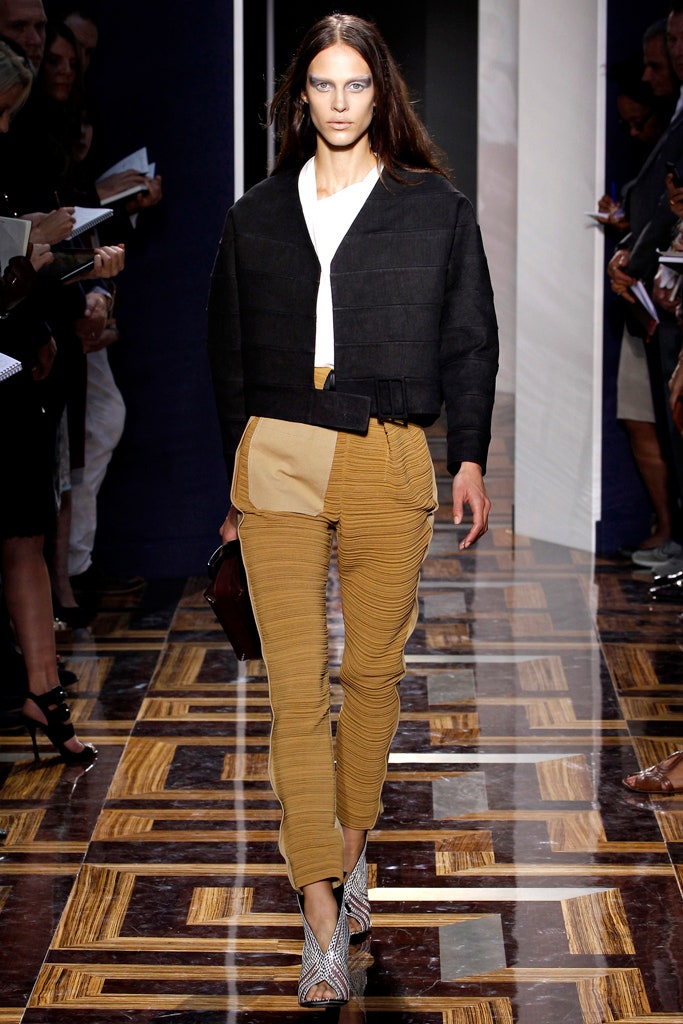 black fitted jacket with beige pants