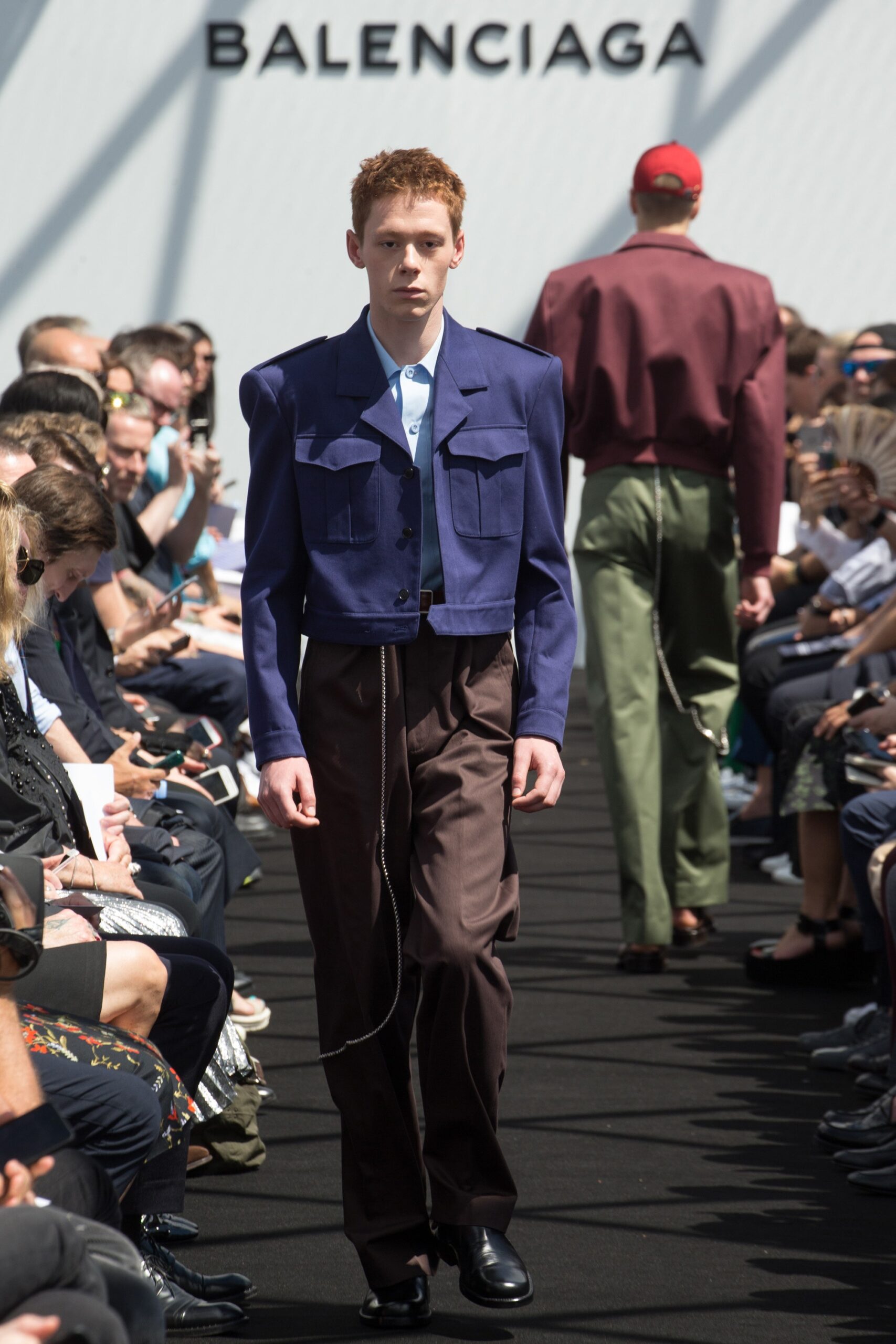 blue fitted jacket and brown pants