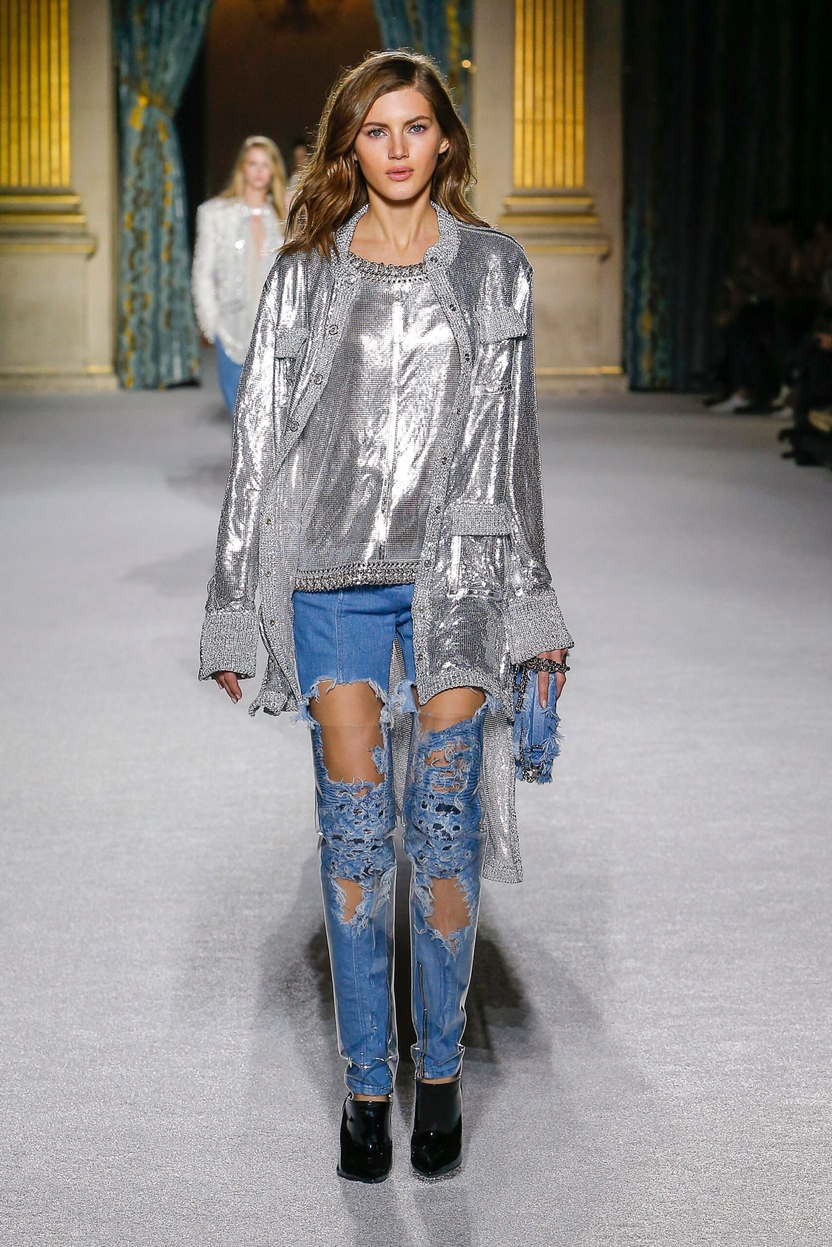 silver relaxed top with distressed jeans