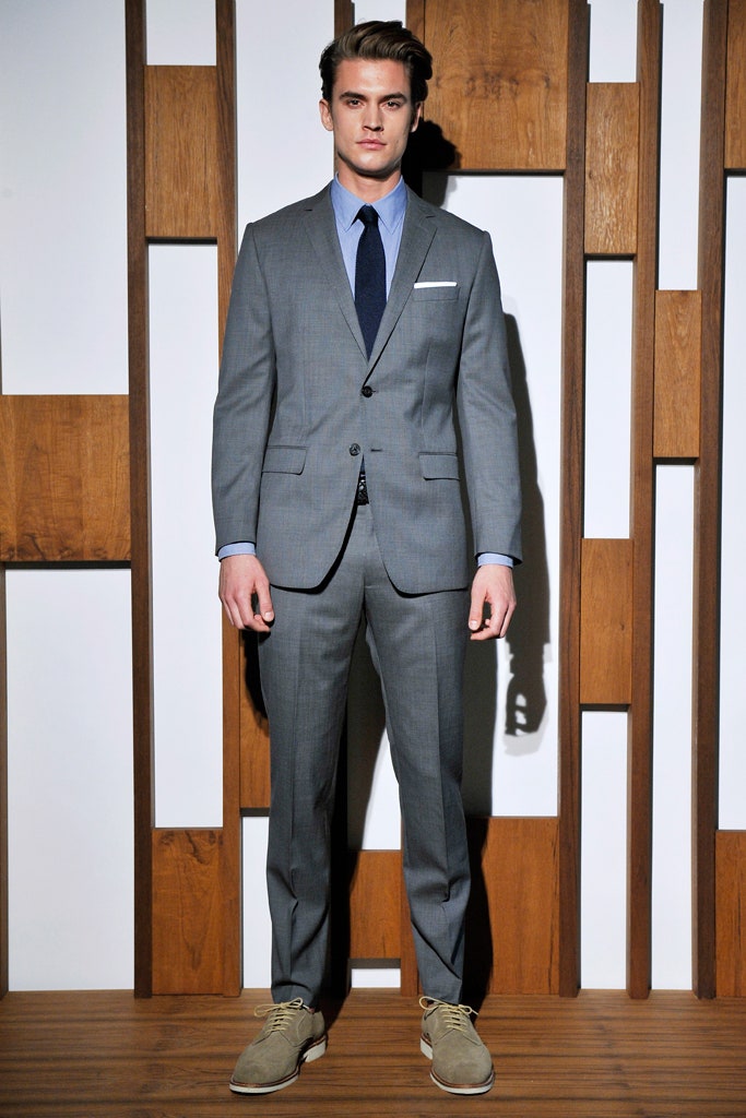 gray tailored suit with blue shirt