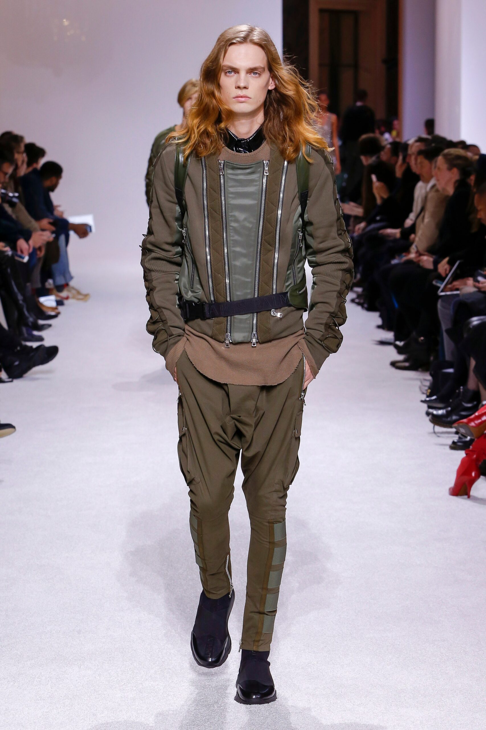 green fitted jacket and relaxed pants